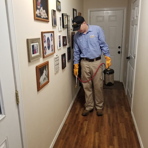 Plank technician performing an indoor pest-control treatment Plank technician performing an indoor pest-control treatment
