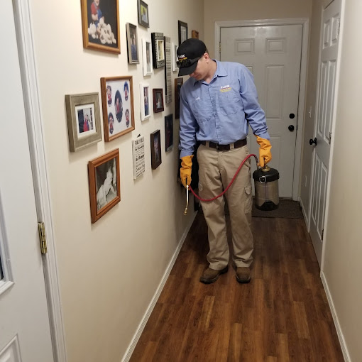 Plank pest control technician inspecting the interior of a Central Missouri home Plank pest control technician inspecting the interior of a Central Missouri home